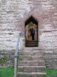 SX16570 Jenni in postern door archway at Goodrich Castle.jpg